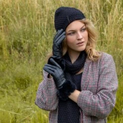 Women’s Touchscreen Three-Point Lined Leather Gloves With Faux Fur Cuffs -Dents Luxury Accessories Sales woman wearing black leather gloves fauxfur cuff