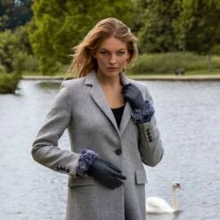 Women’s Touchscreen Three-Point Lined Leather Gloves With Faux Fur Cuffs -Dents Luxury Accessories Sales woman wearing navy leather gloves faux fur cuff