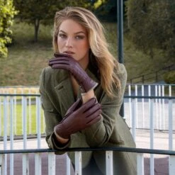 Women’s Three-Point Cashmere-Lined Deerskin Leather Gloves With Cashmere Cuffs -Dents Luxury Accessories Sales woman wearing walnut cashmere lined deerskin gloves